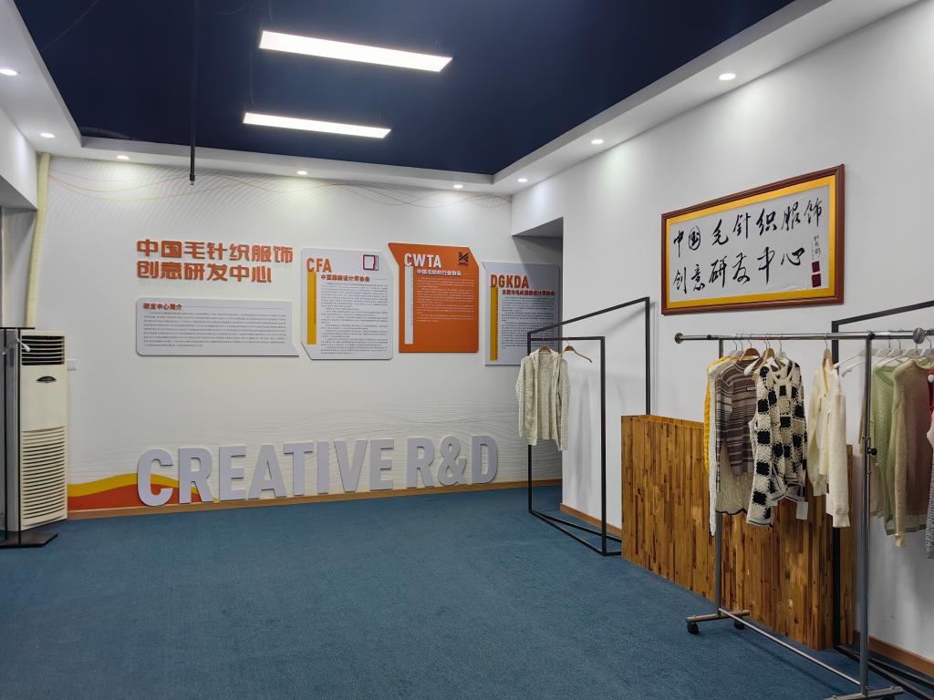 A spacious room with blue walls and white ceiling, illuminated by natural light from the windows on either side of the room.