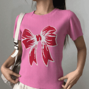 A young woman is standing against a white background.