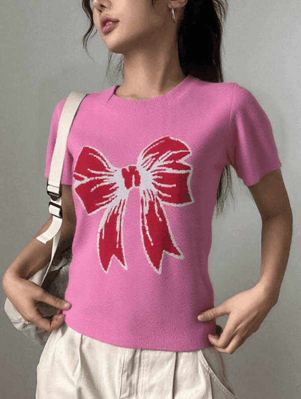 A young woman is standing against a white background.