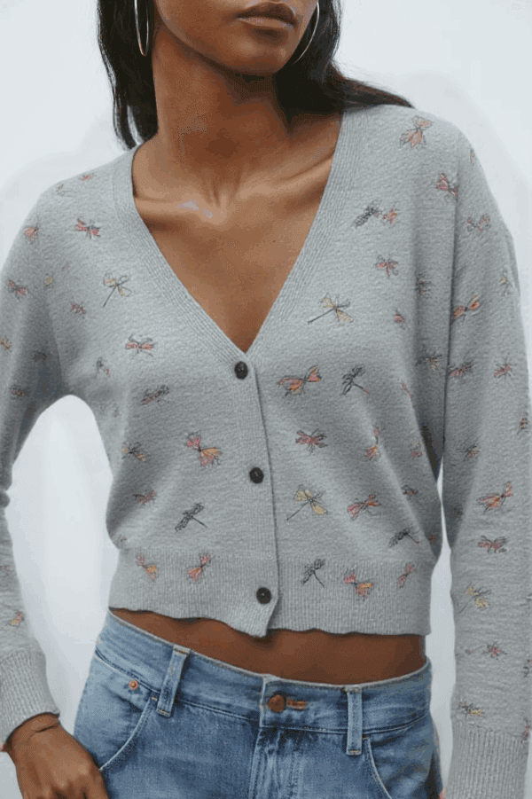 A person is standing against a white background.