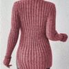 A person wearing a pink sweater with long sleeves and a ribbed texture.